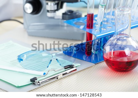 Microscope in a laboratory. Tools for research