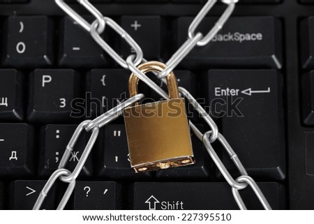 Lock and black keyboard.  Interdiction and chain
