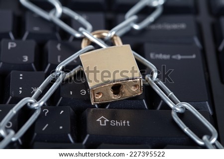 Lock and black keyboard.  Interdiction and chain