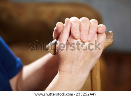 Old woman hands with cane. Senior people health care.
