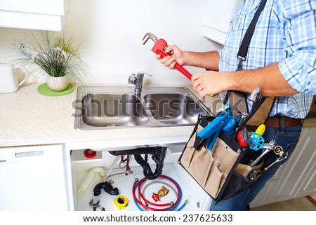 Plumber on the kitchen. Renovation  and plumbing.