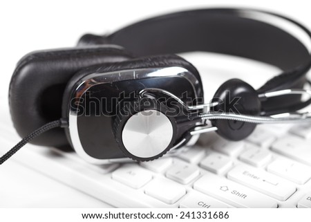 Microphone and headphones on the keyboard. Music and singing