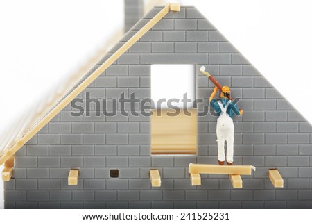 Construction of cottages. Workers at a construction site at home