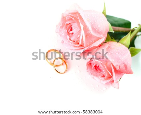 stock photo Roses flowers and two marriage wedding rings