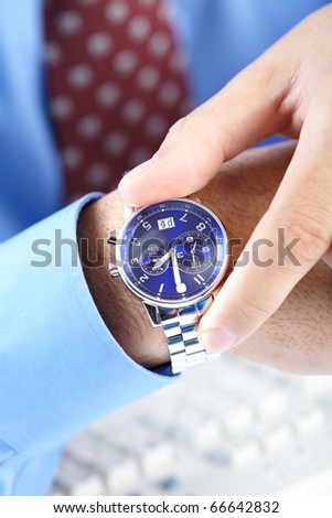 Businessman looking at the watch