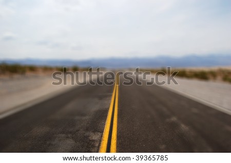 a straight road ahead with motion blur