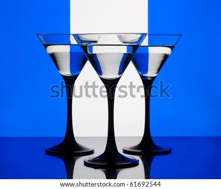 Three martini glass on a blue white and blue background