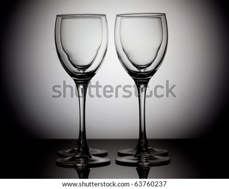 Four empty wine glasses on a circle white background