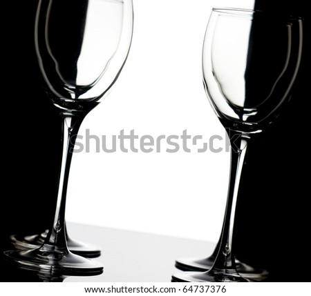 Four empty wine glass over black-white background