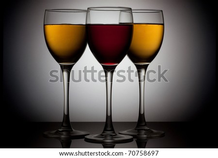 Three glass of wine over circle background