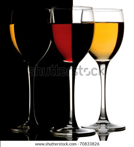 Three wine glass with red and white wine over black-white background