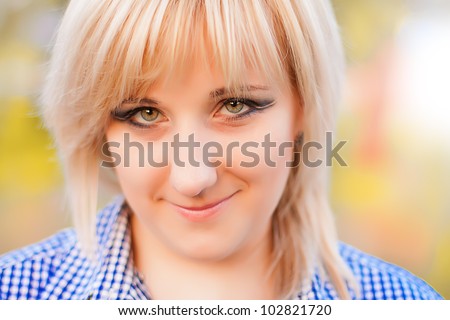 Beautiful young fashionable girl with makeup in the rays sun