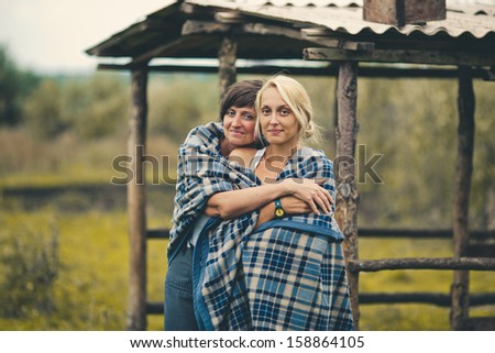Family walk mom and daughter covered plaid