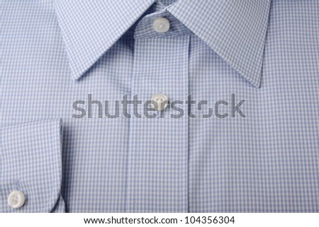 Close up of new formal or business shirt in a blue checked pattern