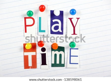 The words Play Time in cut out magazine letters pinned to a sheet of blue lined paper
