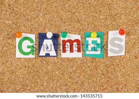 The word Games in cut out magazine letters pinned to a cork notice board