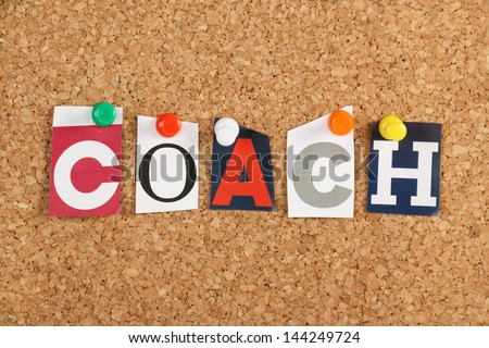The Word Coach In Cut Out Magazine Letters Pinned To A Cork Notice Board. To Coach Has Been Borrowed From Sports By Business To Cover Motivation And Training For Employees.