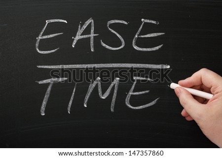Ease Over Time written by hand on a blackboard. Important factors during strategic planning, cost benefit analysis and process improvement.
