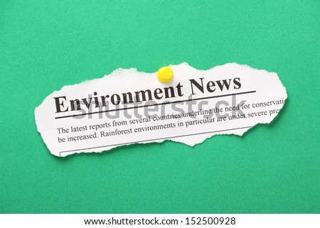 Newspaper clipping for Environment News pinned to a green paper background