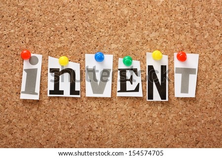 The word Invent in cut out magazine letters pinned to a cork notice board.