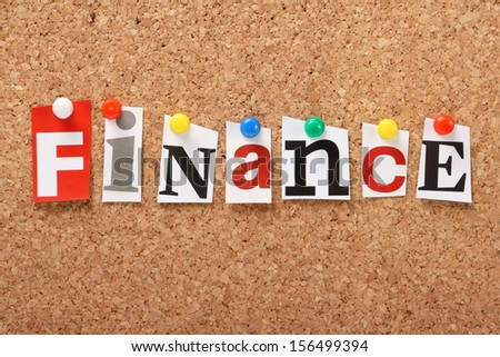 The word Finance in cut out magazine letters pinned to a cork notice board.