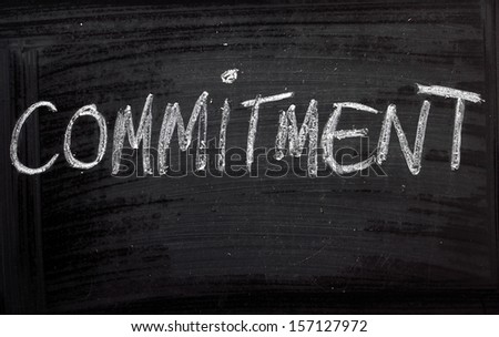The Word Commitment On A Blackboard. We Look For Commitment In Our Relationships But Also In Our Jobs And The Pursuit Of An Education.