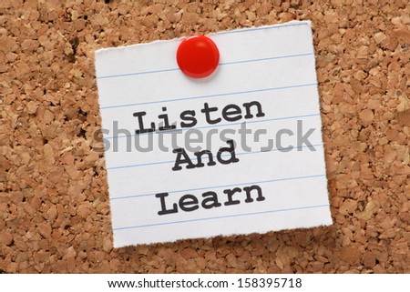 The Phrase Listen And Learn Typed Onto A Scrap Of Lined Paper And Pinned To A Cork Notice Board. This Is The Key To Success In Education And Learning New Skills For The Workplace.