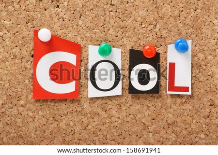 The word Cool in cut out magazine letters pinned to a cork notice board.