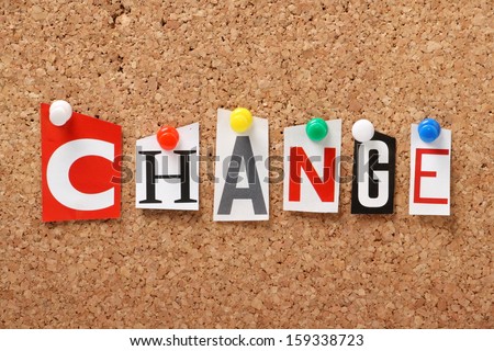 The word Change in cut out magazine letters pinned to a cork notice board