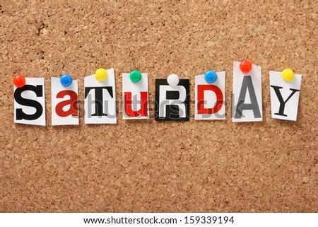The word Saturday in cut out magazine letters pinned to a cork notice board