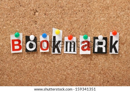 The word Bookmark in cut out magazine letters pinned to a cork notice board.