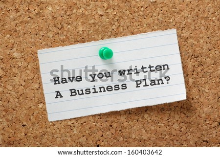 The question, Have You Written a Business Plan on a paper note pinned to a cork notice board. The plan is an essential stage for any start up business as it provides focus and guidance.