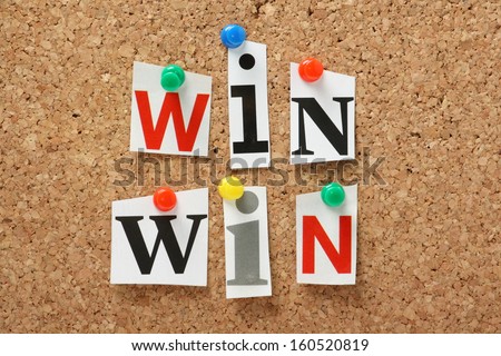 The phrase Win Win in cut out magazine letters pinned to a cork notice board. In any transaction or undertaking we look for mutual benefits and positive outcomes for all parties.