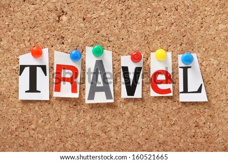 The word Travel in cut out magazine letters pinned to a cork notice board. We check the news for Travel and transport issues and read the travel sections of the newspapers for holiday inspiration.