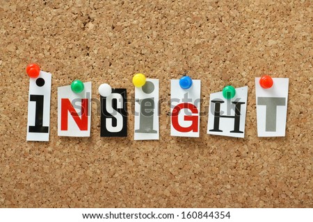 The word Insight in cut out magazine letters pinned to a cork notice board. We trust our insight based on knowledge to make key business or personal decisions.