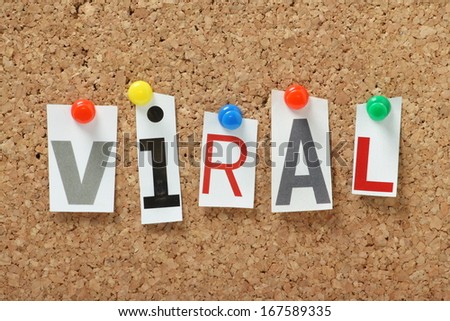 The Word Viral In Magazine Letters Pinned To A Cork Notice Board. Viral Is Often Used To Describe An Image,Video Or Product That Is Widely Circulated On The Internet.