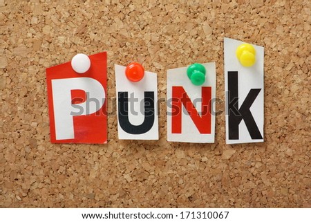 Punk, the word for a genre of modern music and fashion style in cut out magazine letters pinned to a cork notice board