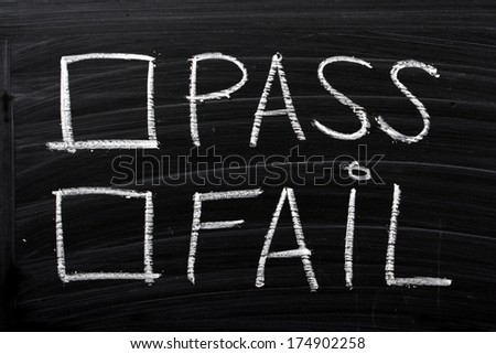 Tick boxes for Pass or Fail on a wiped blackboard