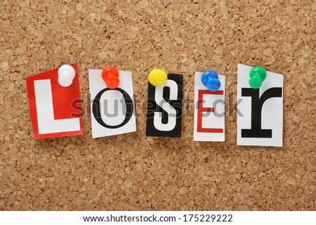 The word Loser in cut out magazine letters pinned to a cork notice board