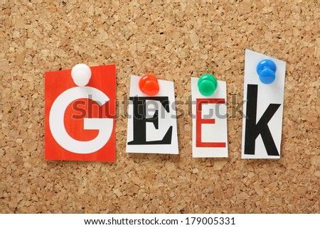 The word Geek in cut out magazine letters pinned to a cork notice board