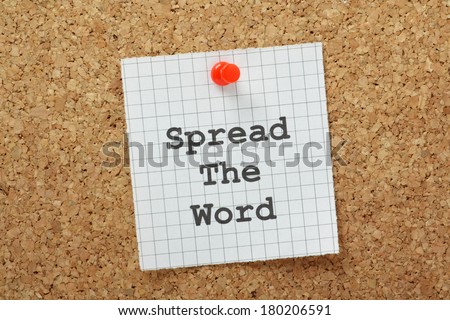 Spread the Word typed on a piece of graph paper and pinned to a cork notice board