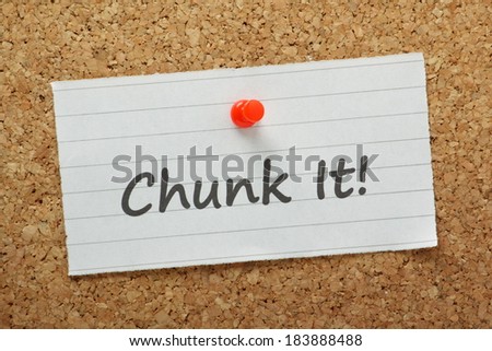 The phrase Chunk It! on a cork notice board. A method used to break up projects and complex tasks into smaller, more manageable stages to improve efficiency and productivity.
