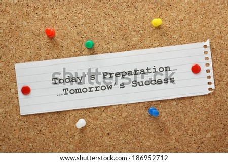 Today\'s Preparation Leads to Tomorrow\'s Success concept on a cork notice board.