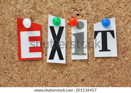 The word Exit in cut out magazine letters pinned to a cork notice board