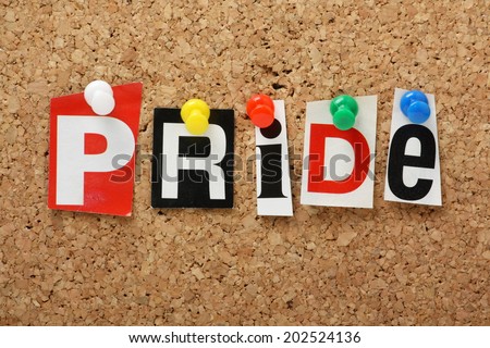 The word Pride, one of the seven deadly sins in cut out magazine letters pinned to a cork notice board