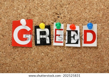 The word Greed, one of the seven deadly sins in cut out magazine letters pinned to a cork notice board
