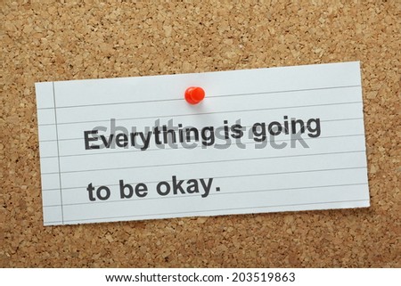 The phrase Everything is going to be Okay typed on a piece of paper and pinned to a cork notice board