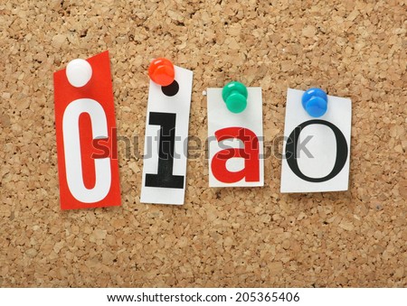 The Italian word Ciao in cut out magazine letters pinned to a cork notice board. Ciao is the informal word for hello or goodbye.