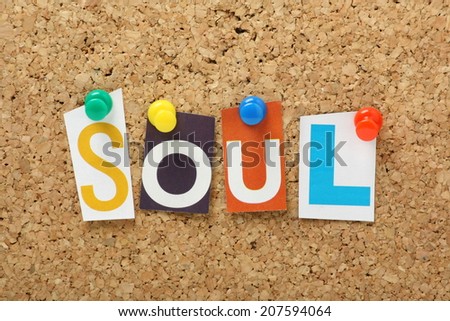 The word Soul in cut out magazine letters pinned to a cork notice board. Soul music emerged in the twentieth century from cities including Detroit and Chicago in the USA