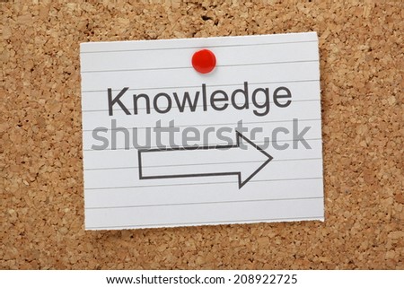 The word Knowledge above an arrow pointing in the right direction on a cork notice board